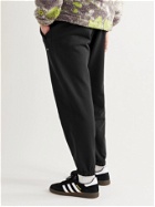 ADIDAS ORIGINALS - Adicolor Tapered Logo-Appliquéd Loopback Organic Cotton-Jersey Sweatpants - Black