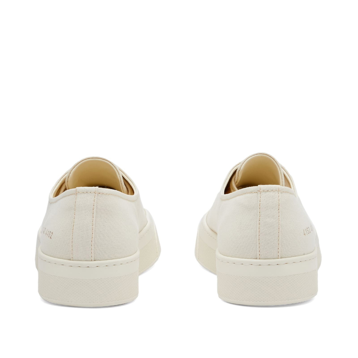 Woman by Common Projects Women's Four Hole Canvas Sneakers in Off White ...