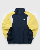 New Balance In Game Woven Track Jacket blue/yellow Men