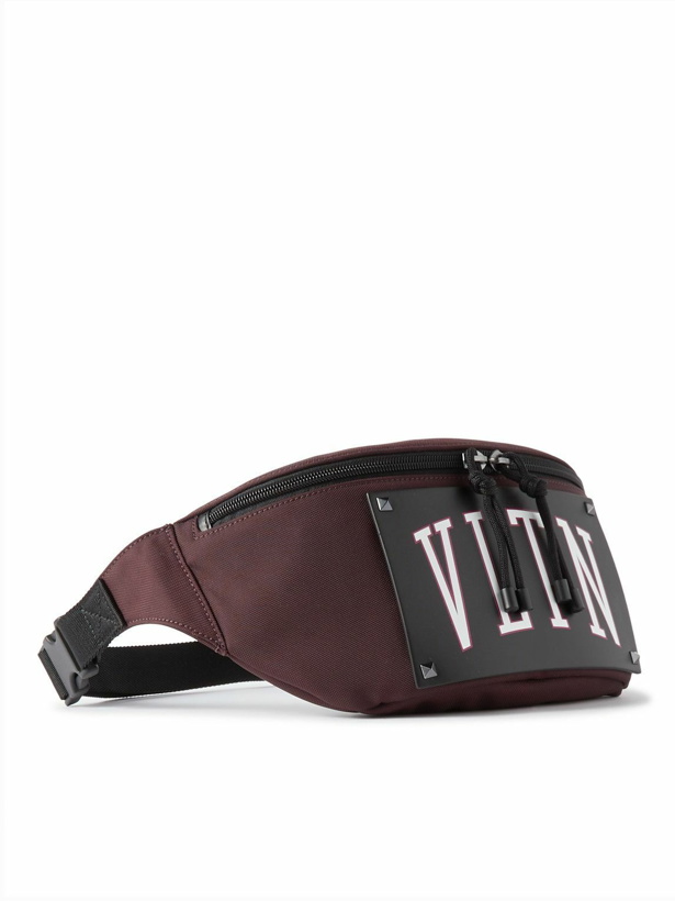 Photo: Valentino Garavani - Valentino Garavani Logo-Print Leather-Trimmed Canvas Belt Bag