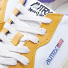 Autry Men's Cracked Super Vintage Low Sneakers in White/Yellow