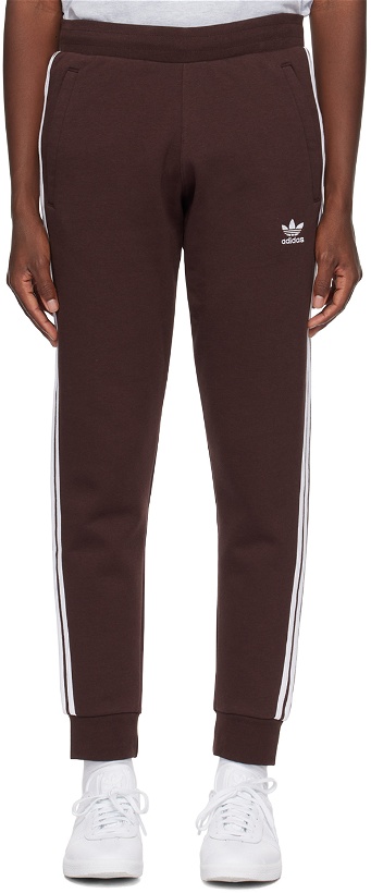 Photo: adidas Originals Brown 3-Stripe Sweatpants