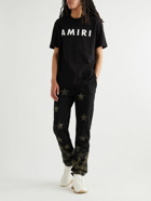 AMIRI - Chemist Star Leather Appliquéd Cotton-Jersey Sweatpants - Black