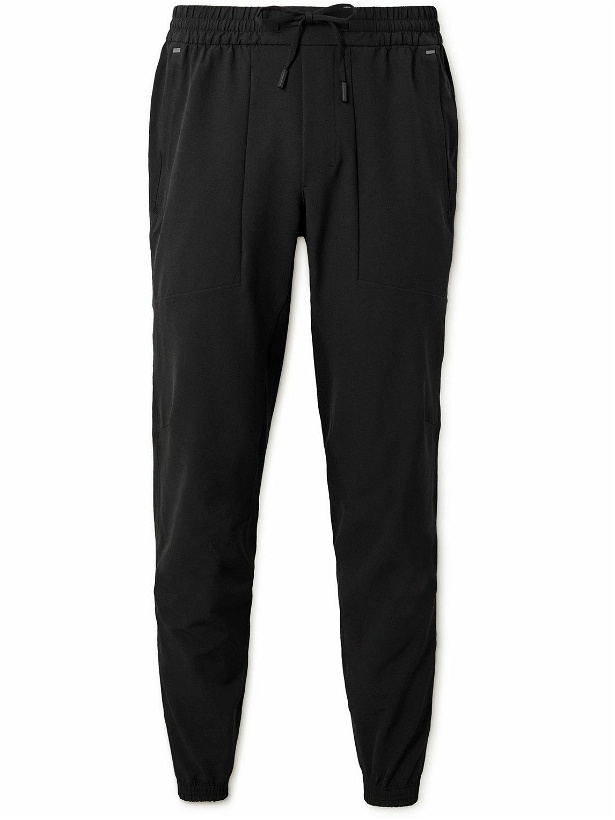 Photo: Lululemon - License to Train Tapered Recycled Stretch-Shell Track Pants - Black