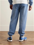 Y,IWO - Hardwear Logo-Print Distressed Cotton-Jersey Sweatpants - Blue