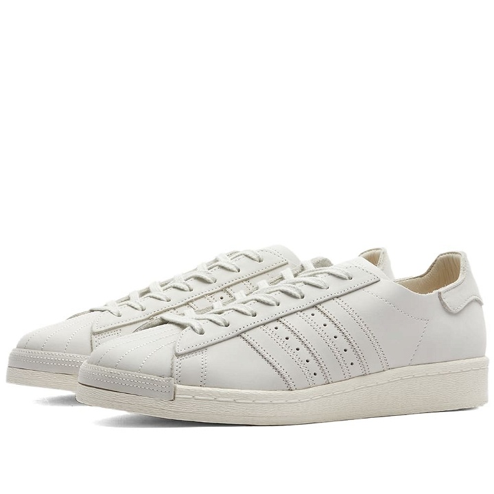 Photo: Adidas Men's Superstar 82 Sneakers in Core White/Alumina/Off White