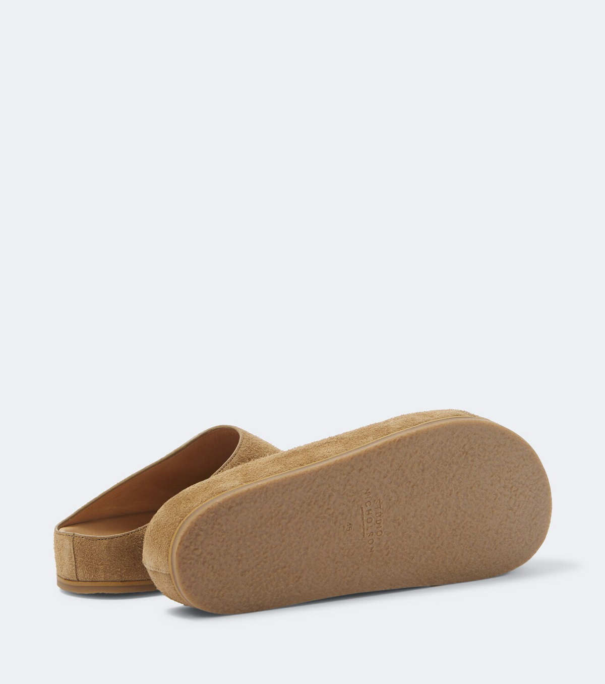 Studio Nicholson Wearing suede mules