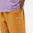 Nike Men's Solo Swoosh Fleece Pant in Desert Ochre/White