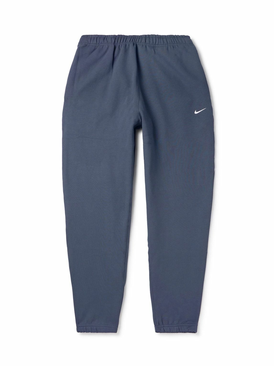Photo: Nike - Solo Swoosh Tapered Logo-Embroidered Cotton-Blend Jersey Sweatpants - Blue