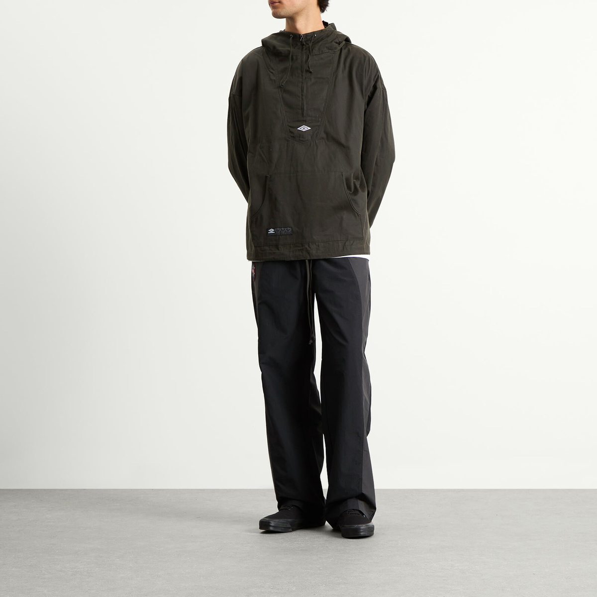 Umbro by Slam Jam Men's Masked Waxed Anorak in Dark Olive