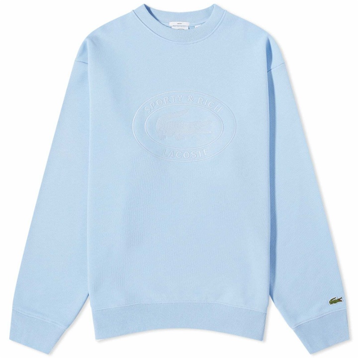 Photo: Sporty & Rich x Lacoste Oval Logo Embroidered Crew Sweat in Panorama