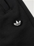ADIDAS ORIGINALS - Adicolor Tapered Logo-Appliquéd Loopback Organic Cotton-Jersey Sweatpants - Black