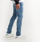 AMIRI - Skinny-Fit Distressed Panelled Stretch-Denim Jeans - Blue