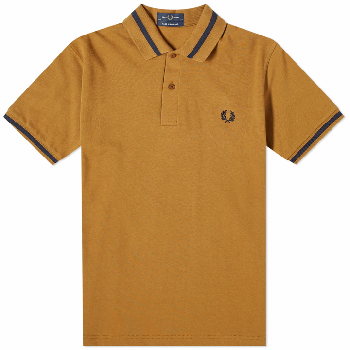 Photo: Fred Perry Men's Single Tipped Polo Shirt in Dark Caramel/Navy