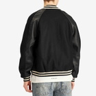 Represent Men's Raglan Varsity Jacket in Black