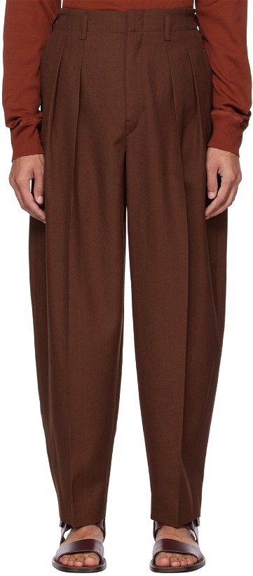 Photo: LEMAIRE Brown Pleated Tapered Trousers