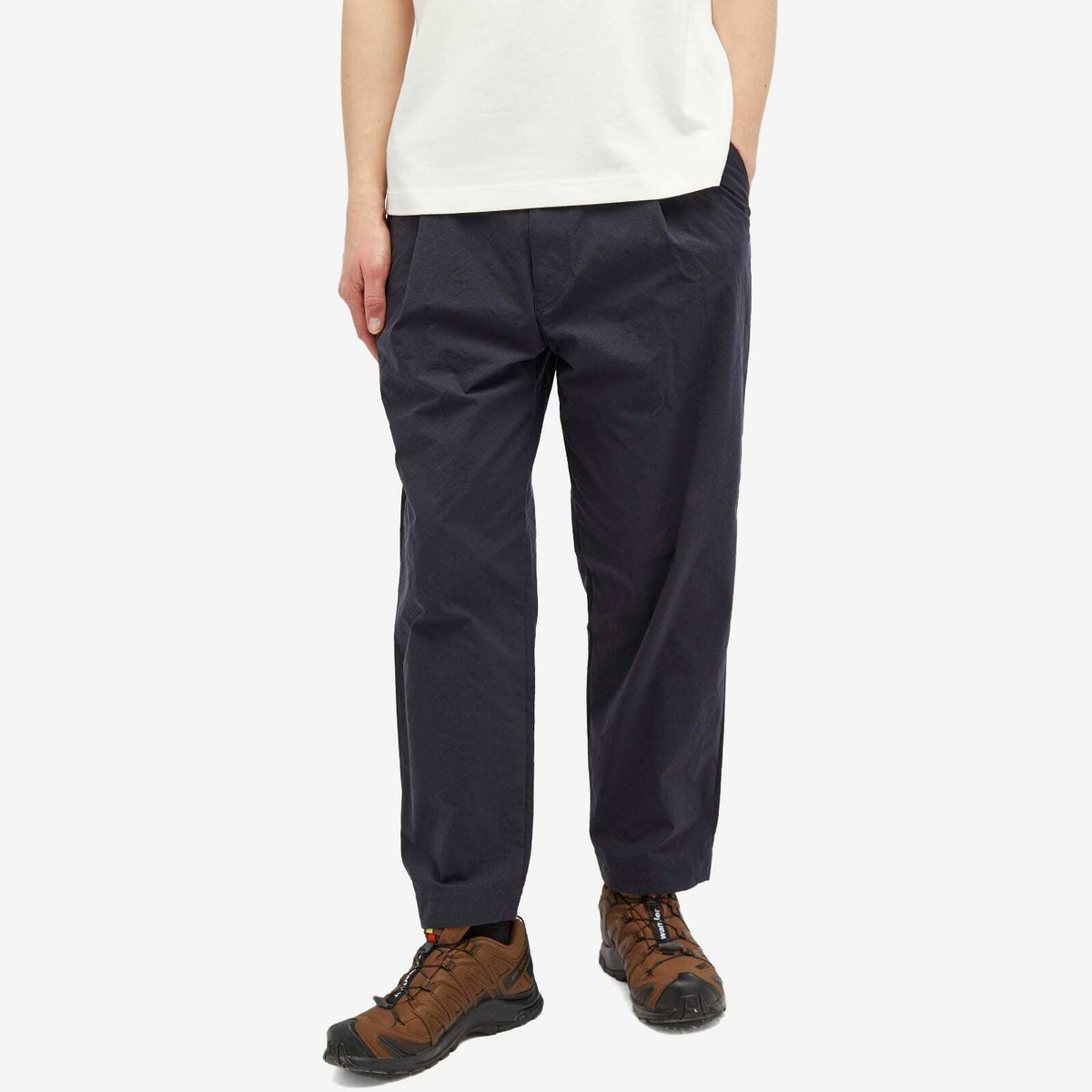 and wander Men's Nylon Chino Tuck Tapered Pants in Navy and