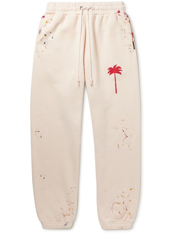 Photo: Palm Angels - Tapered Logo-Print Paint-Splattered Cotton-Jersey Sweatpants - Neutrals