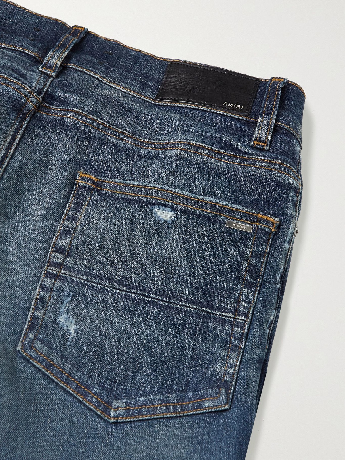 AMIRI - MX1 Skinny-Fit Distressed Leather-Panelled Stretch-Denim 