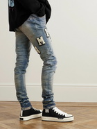 AMIRI - Skinny-Fit Logo-Appliquéd Distressed Jeans - Blue