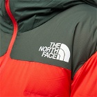 The North Face Men's x Undercover Soukuu Cloud Down Nupste Jacket in High Risk Red/Dark Cedar Green