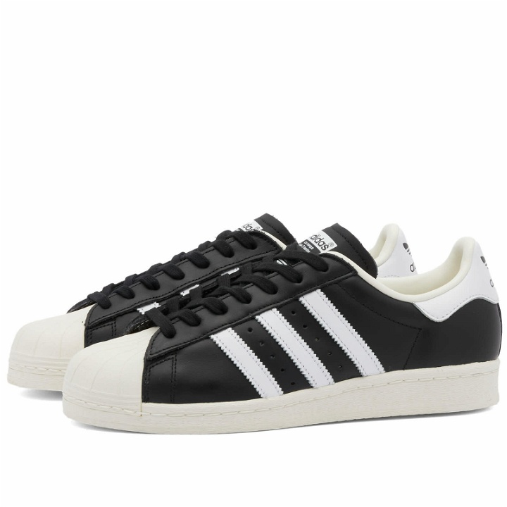 Photo: Adidas Men's Superstar 82 Sneakers in Core Black/White/Off White