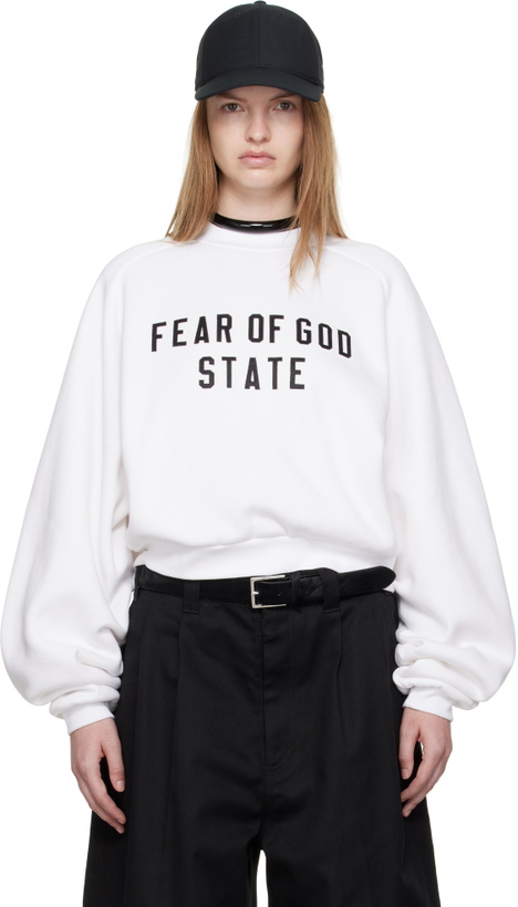 Photo: Fear of God ESSENTIALS White Fleece Raglan Crewneck Sweatshirt