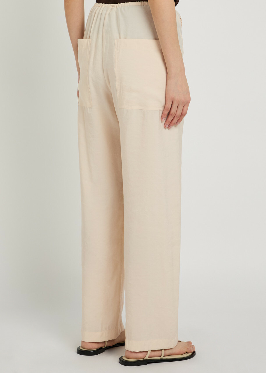 Studio Nicholson Drawstring Straight-leg Modal-blend Trousers Beige