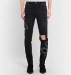 AMIRI - Skinny-Fit Appliquéd Distressed Stretch-Denim Jeans - Men - Black