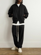 Fear of God - Tapered Logo-Appliquéd Shell Sweatpants - Black