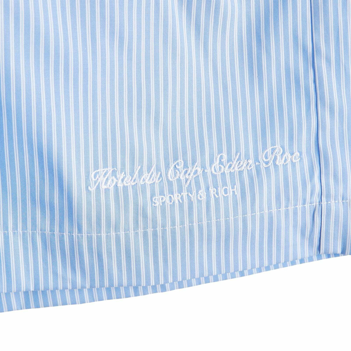 Sporty & Rich Hotel du Cap Cursive Poplin Short in Blue/White Thin Stripe White