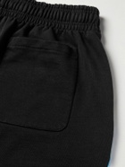 VETEMENTS - Wide-Leg Logo-Print Cotton-Jersey Sweatpants - Black