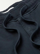 Stone Island - Tapered Logo-Appliquéd Garment-Dyed Cotton-Jersey Sweatpants - Blue