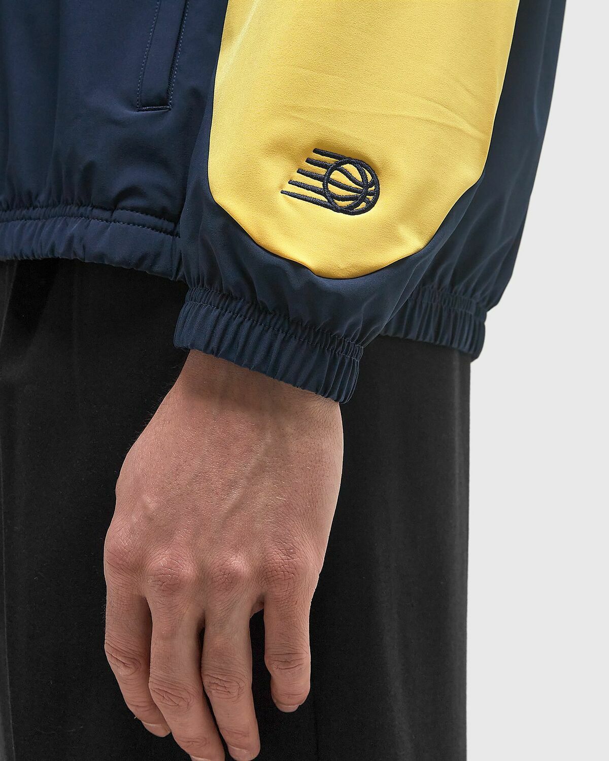New Balance In Game Woven Track Jacket blue/yellow Men