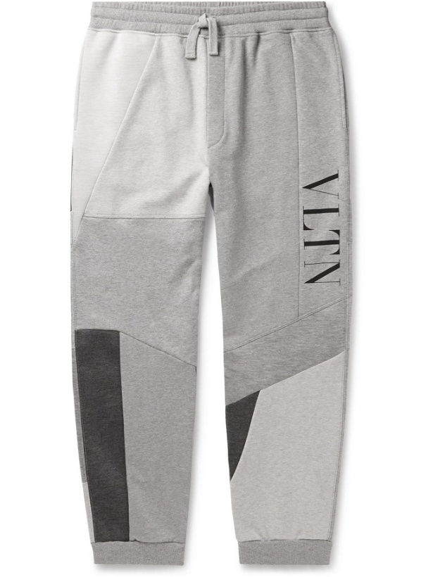 Photo: Valentino - Tapered Patchwork Logo-Print Cotton-Blend Jersey Sweatpants - Gray