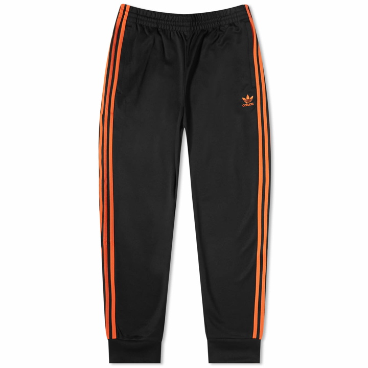 Photo: Adidas Men's Superstar Track Pant in Black/Orange