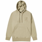 Norse Projects Men's Arne Relaxed N Logo Hoodie in Sand