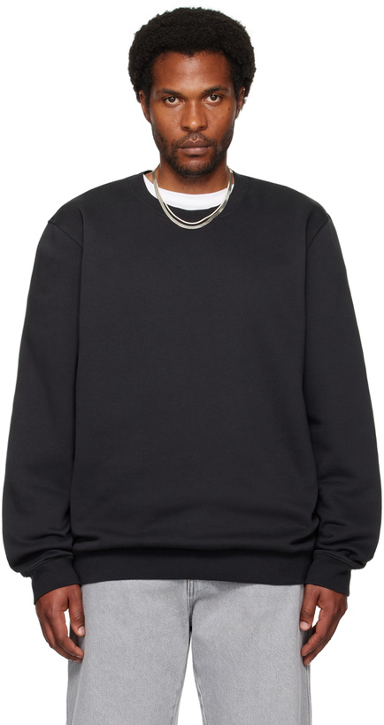 Photo: SKIMS Black Fleece Lounge Crewneck Sweatshirt