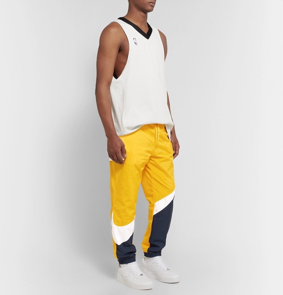 Nike - Tapered Logo-Print Colour-Block Nylon Track Pants - Men