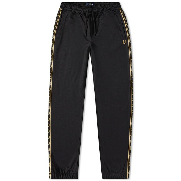 Photo: Fred Perry Authentic Men's Seasonal Taped Track Pant in Black/1964 Gold