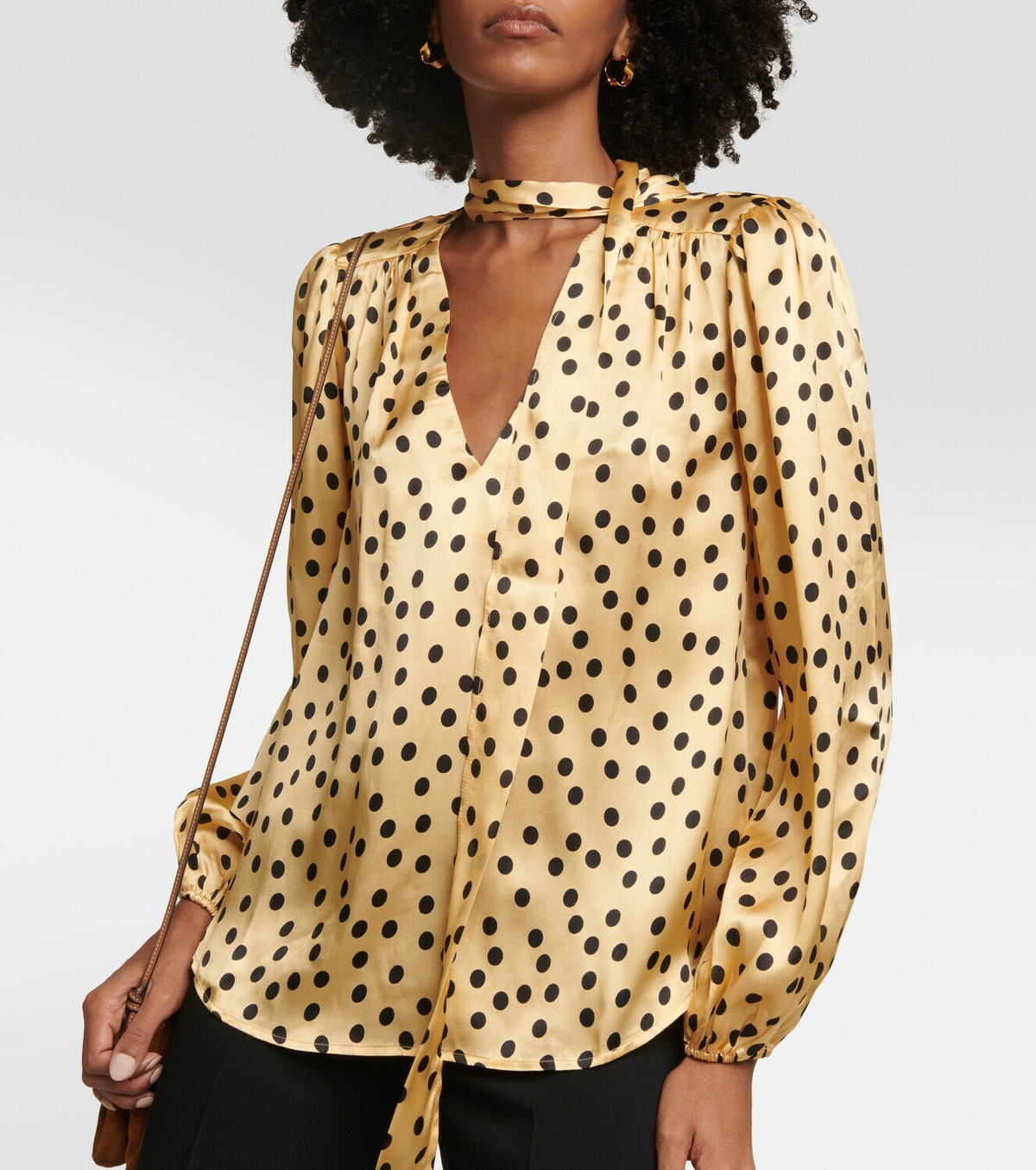 black blouse with gold polka dots