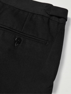 Stòffa - Tapered Pleated Cotton-Canvas Trousers - Black