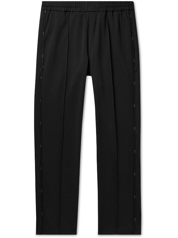 Photo: MCQ - Tapered Logo-Appliquéd Pintucked Stretch-Jersey Sweatpants - Black