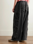 Acne Studios - Prowser Wide-Leg Distressed Appliquéd Cotton-Jersey Sweatpants - Black