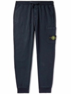 Stone Island - Tapered Logo-Appliquéd Garment-Dyed Cotton-Jersey Sweatpants - Blue