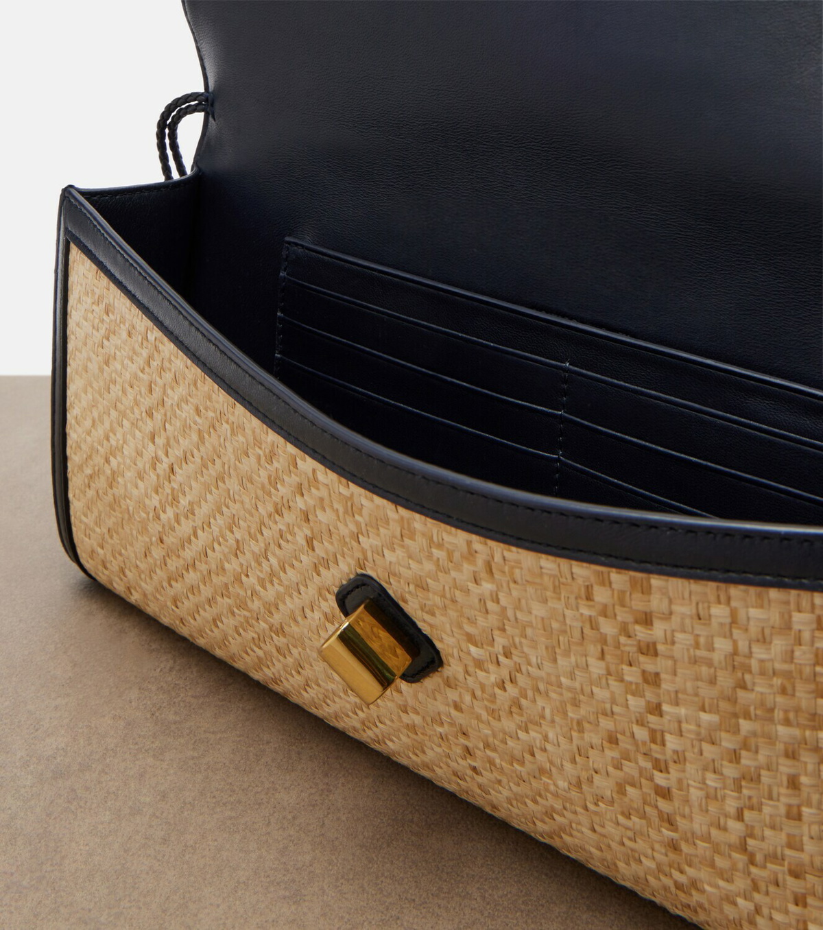 Bottega Veneta Andiamo leather-trimmed raffia clutch