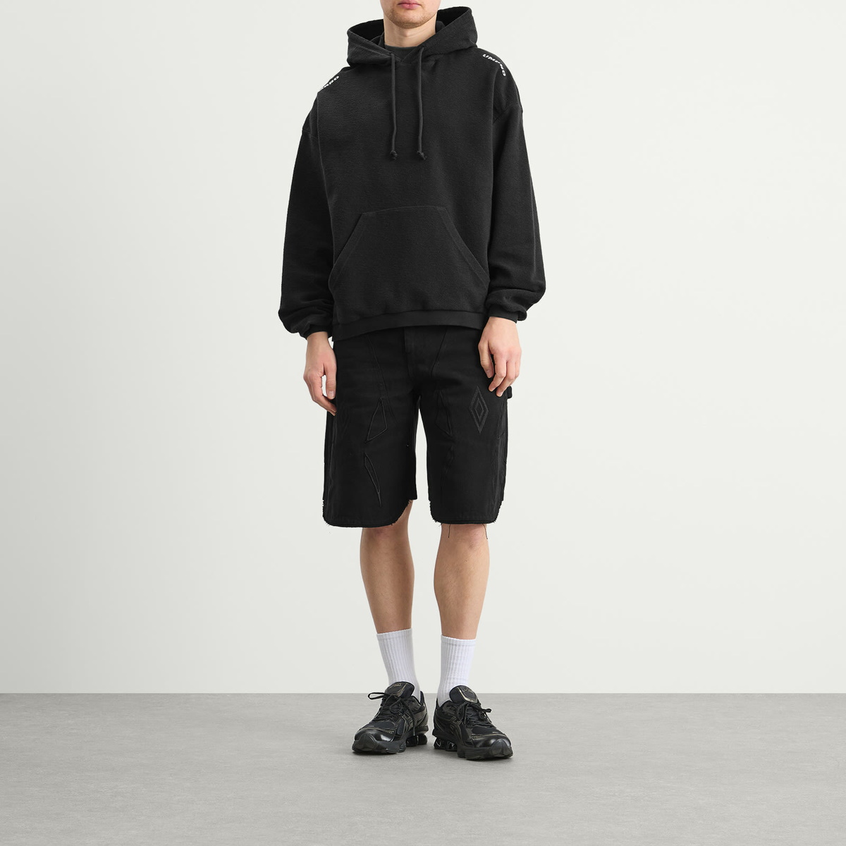 Umbro by Slam Jam Men's Lasered Masked Hoodie in Washed Black
