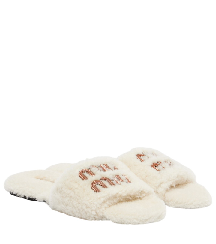 Photo: Miu Miu Logo leather-trimmed shearling slides