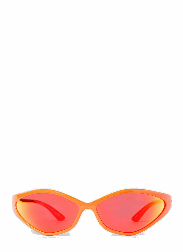 Photo: Balenciaga - 0285S 90s Oval Sunglasses in Orange