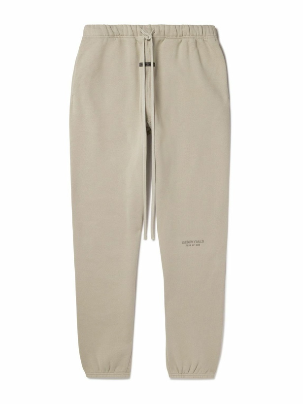 Photo: FEAR OF GOD ESSENTIALS - Tapered Logo-Appliquéd Cotton-Blend Jersey Sweatpants - Neutrals